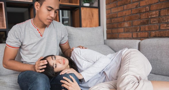Photo of a couple comforting each other