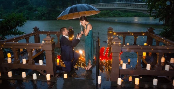 Photo of Taddy proposing in the rain