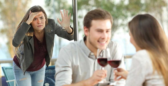 Photo of a girl spying on a couple on a date