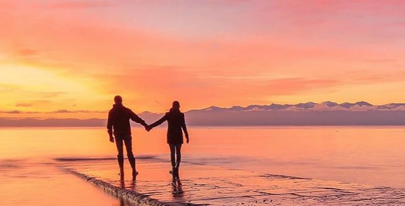 Photo of a couple walking in Victoria, BC