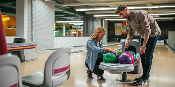 Photo of a couple bowling