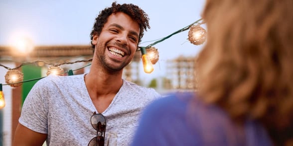 Photo of a man talking and smiling