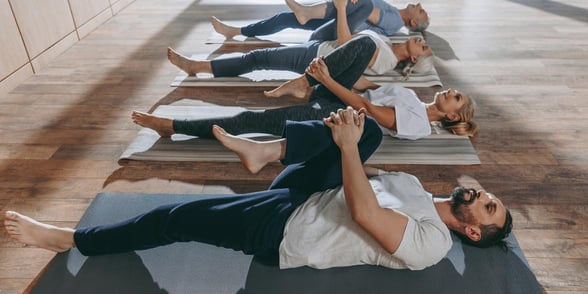Photo of people in a yoga class