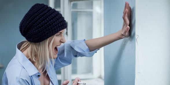 Photo of a woman hitting a wall Photo of a woman hitting a wall