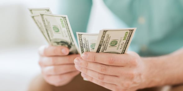 Photo of a man counting money