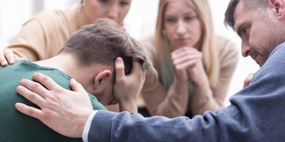 Photo of friends supporting each other