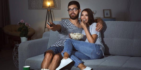 Photo of a couple watching a movie Photo of a couple watching a movie