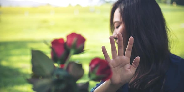 Photo of a woman rejecting flowers