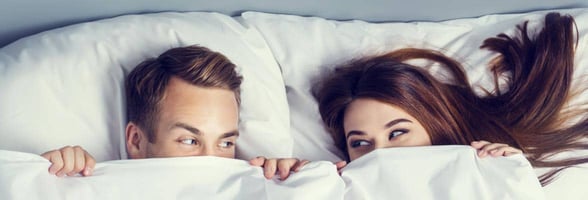Photo of a couple in bed together