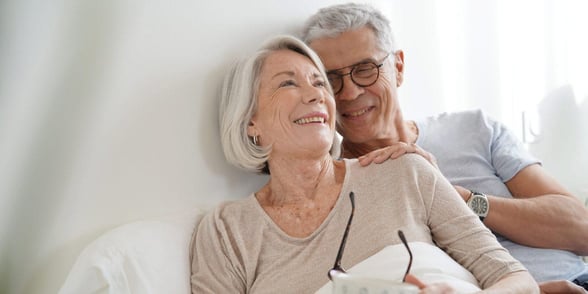 Photo of an older couple in bed