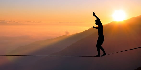 Photo of a man on a tightrope