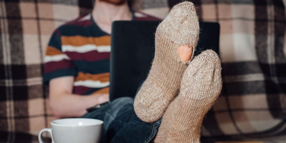 Photo of a man with a hole in his sock