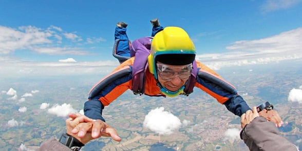 Photo of a senior skydiving