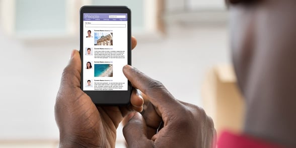 Photo of a man looking at a dating profile
