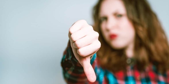 Photo of a woman doing thumbs down
