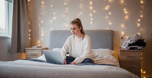 Photo of a single woman on her computer