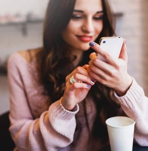 Photo of a woman using a dating app Photo of a woman using a dating app