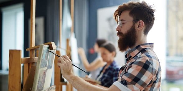 Photo of a man painting