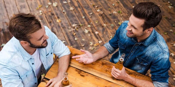 Photo of two men talking