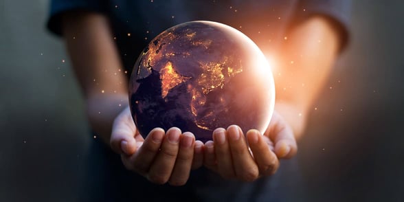 Photo of a man holding the world in his hands