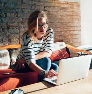 Photo of a woman on a laptop Photo of a woman on a laptop