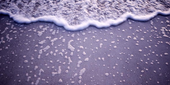 Photo of a beach ebbing and flowing Photo of a beach ebbing and flowing