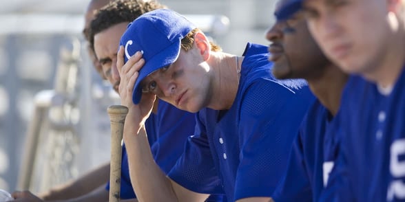 Photos of baseball players on a bench