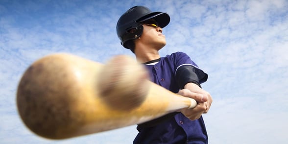 Photo of a baseball player hitting a ball