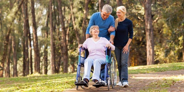 Photo of a mature couple taking care of an elderly parent Photo of a mature couple taking care of an elderly parent