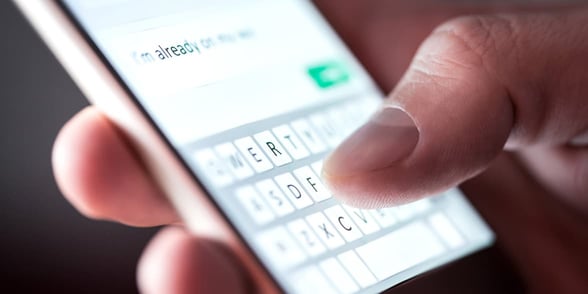 Photo of a man texting