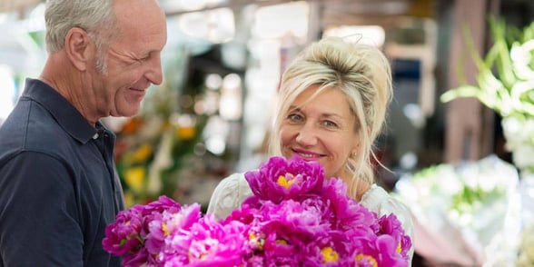 Photo of senior couple and flowers