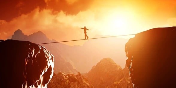 Photo of a man on a tightrope Photo of a man on a tightrope