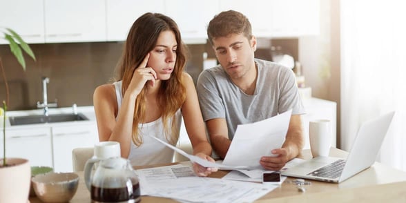 Photo of a couple solving a problem together Photo of a couple solving a problem together