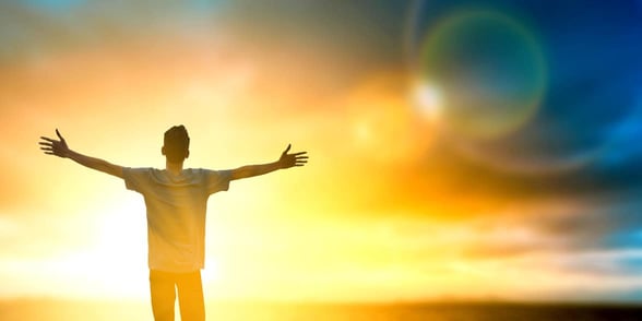 Photo of a man with his arms open