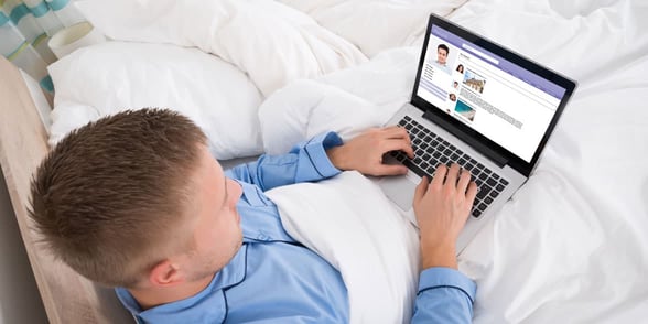 Photo of a man on a laptop Photo of a man on a laptop