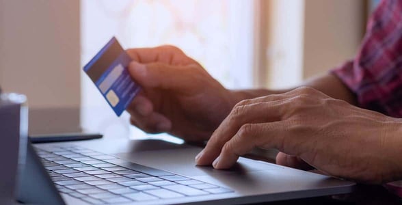 Photo of a man with a credit card