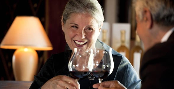 Photo of a mature couple with wine