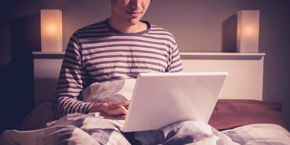 Photo of a man on a laptop