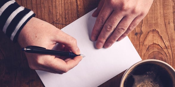 Photo of a person writing a letter