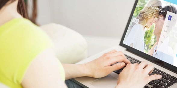 Photo of a woman on a laptop