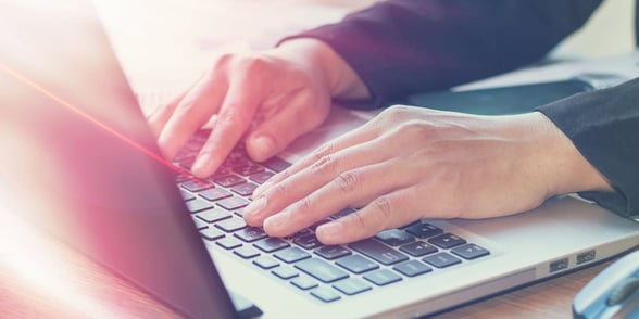 Photo of a man typing