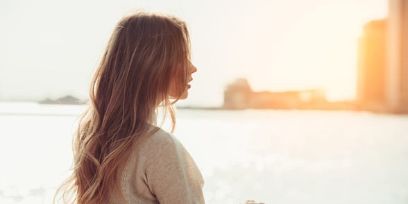 Photo of a woman looking at the water