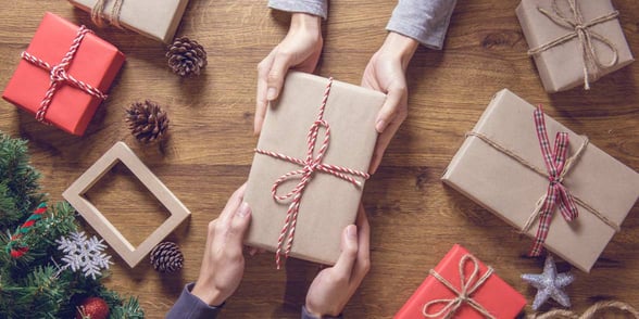 Photo of couple giving gifts
