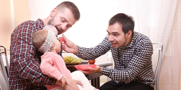 Photo of a gay couple with a child Photo of a gay couple with a child