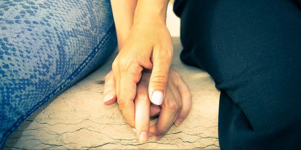 Photo of lesbian couple holding hands