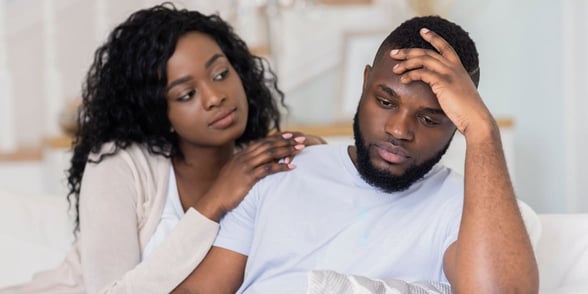 Photo of woman comforting her boyfriend