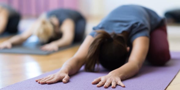 Photo of women doing yoga