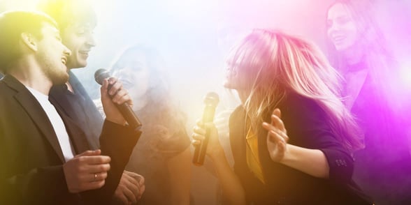 Photo of people doing karaoke Photo of people doing karaoke
