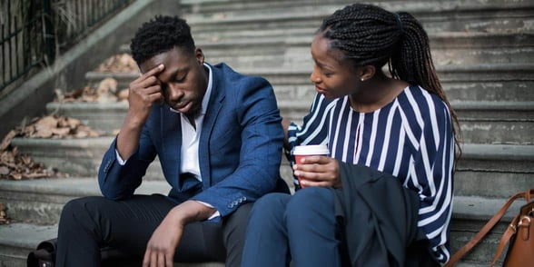 Photo of woman comforting man