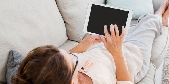 Photo of a woman on a tablet Photo of a woman on a tablet